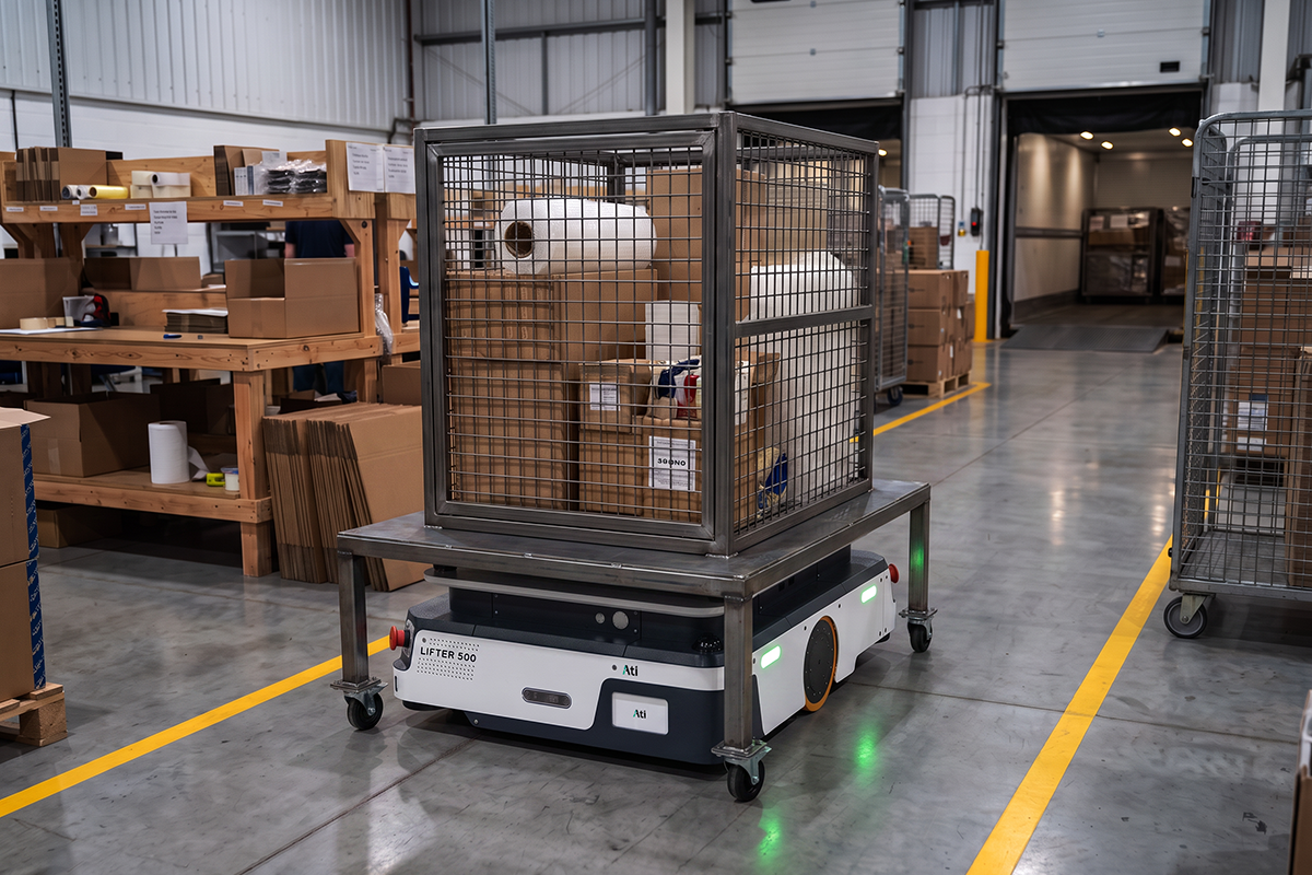 Sherpa Lifter 500 with rack attachment moving stock rolls in a facility